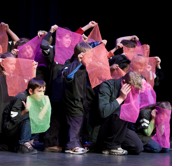 children pose with coloured scarves