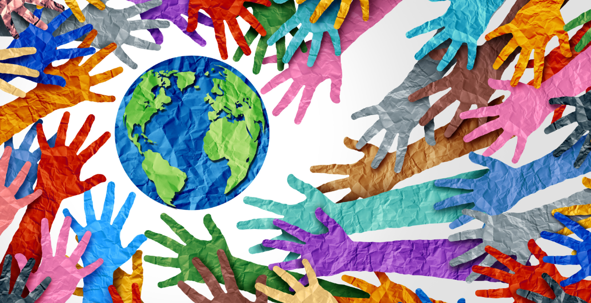 colourful paper hand reaching out to the Earth