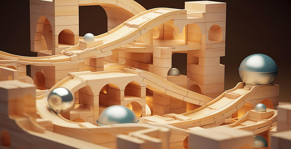 picture showing motion of grey balls moving in wooden apparatus to show motion and energy of objects