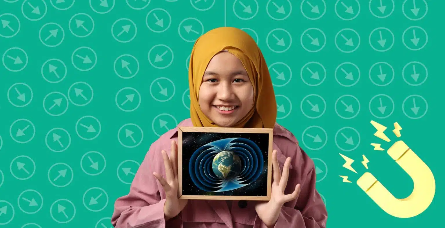 Little girl in yellow hijab and pink top holds a tiny black board with Earth's magnetic pull and patterns. Yellow magnet in the corner on a green background.