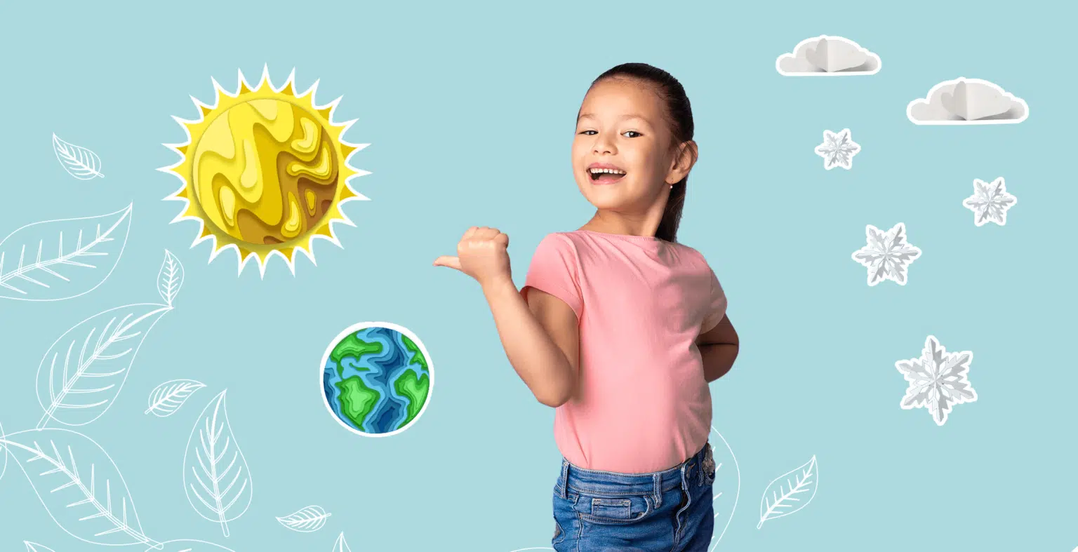 little girl in pink shirt points at sun and earth and clouds in the background